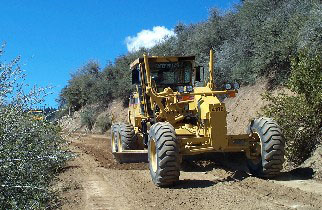 County grader applies outsloping to reduce sedimentation