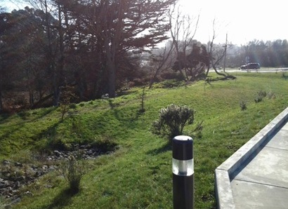 A vegetated swale can be an aesthetically pleasing way to convey water around a site and protect downstream waterways